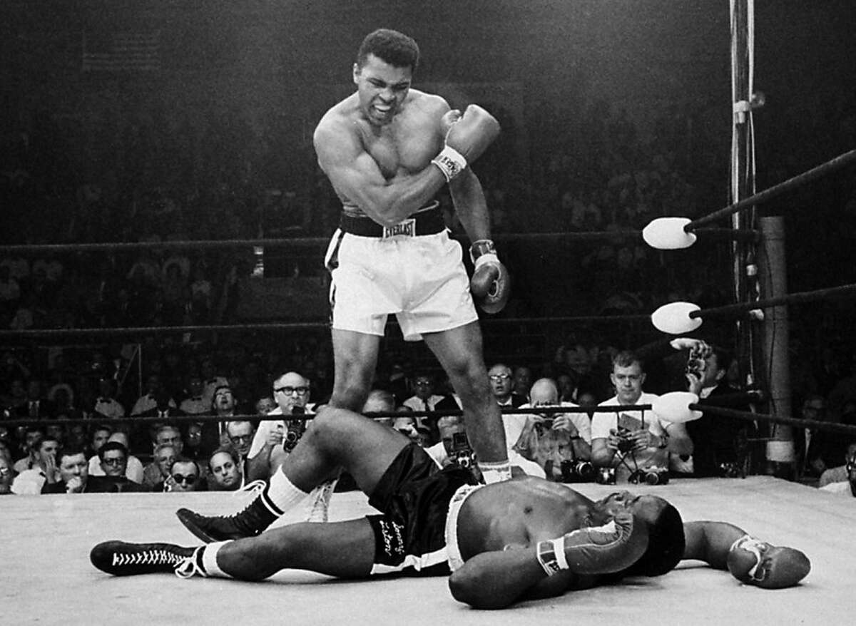 FILE - In this May 25, 1965, file photo, heavyweight champion Muhammad Ali stands over fallen challenger Sonny Liston, after dropping Liston with a short hard right to the jaw in Lewiston, Maine.