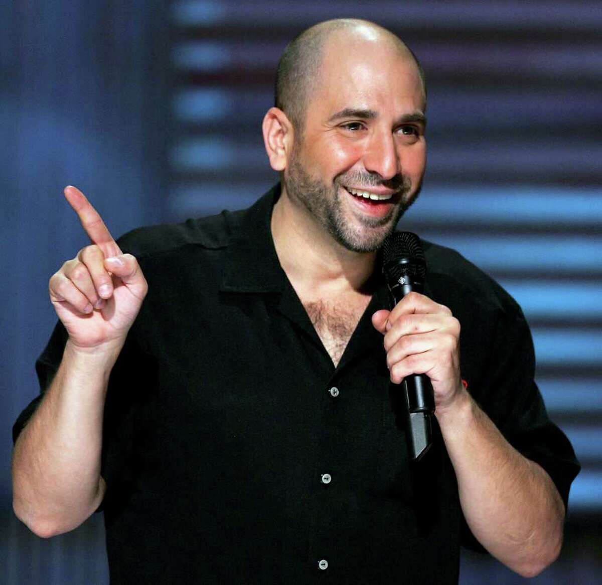 LAS VEGAS - JULY 03: Comedian Dave Attell performs at the House of Blues inside the Mandalay Bay Resort & Casino July 3, 2005 in Las Vegas, Nevada. Comedy Central is shooting the television network's first original stand-up film, "Dave Attell's Insomniac Tour." (Photo by Ethan Miller/Getty Images for Comedy Central) *** Local Caption *** Dave Attell
