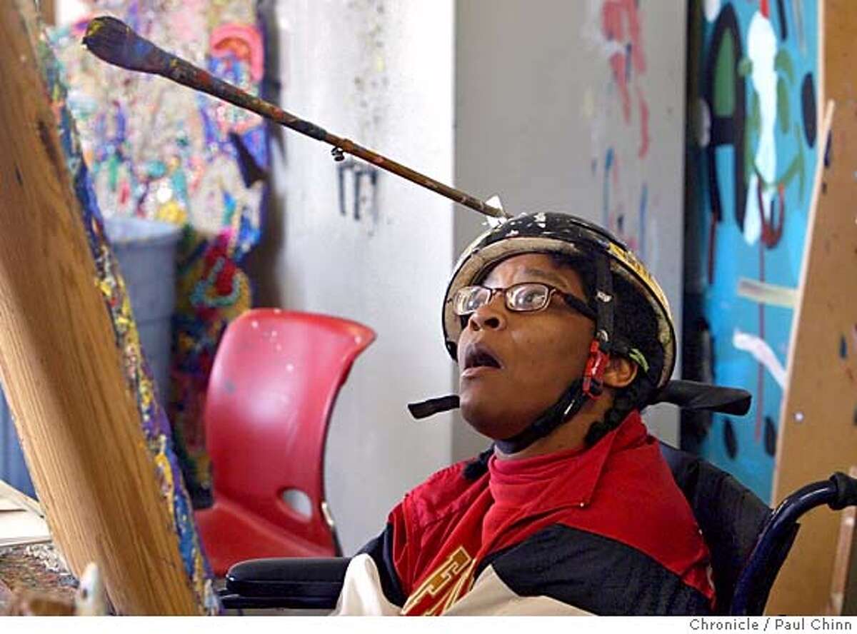 disabled_167_pc.jpg Mia Brown, an artist at the National Institute of Art & Disabilities, works on her art project on 12/2/05 in Richmond, Calif. An exhibit of pizza boxes designed by several of the artists is on display at the Cheeseboard Pizza Collective in Berkeley. PAUL CHINN/The Chronicle MANDATORY CREDIT FOR PHOTOG AND S.F. CHRONICLE/ - MAGS OUT