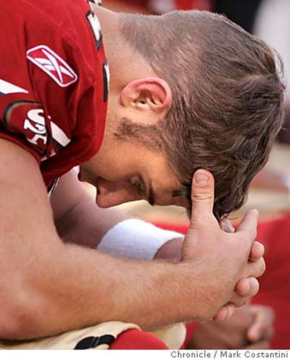 49ers quarterback Alex Smith buries his head in his hands late in the final seconds of the game. 49ers lose to the Arizona Cardinals as Monster Park. Event on 12/04/05 in San Francisco Photo: Mark Costantini /San Francisco Chronicle