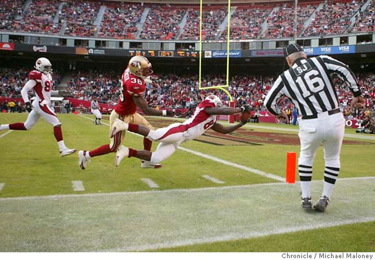 49ERS_388_MJM.jpg Cardinals Anquan Boldin dives into the endzone for a 4th quarter TD. 49ers #36 Shawntae Spencer. Cardinals #80 at left is Bryant Johnson. SF 49ers vs Arizona Cardinals at Monster park. Event in San Francisco, CA Photo by Michael Maloney / The Chronicle MANDATORY CREDIT FOR PHOTOG AND SF CHRONICLE/ -MAGS OUT