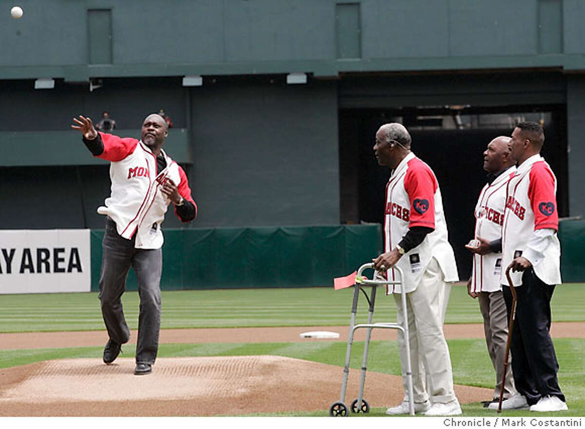 As part of the Black Aces tribute, (from left) Dave Stewart throws out 1st ball as Jim "Mudcat" Grant, Vida Blue and Mike Norris look on. A's v. Texas Rangers at the Coliseum PHOTO: Mark Costantini / The Chronicle MANDATORY CREDIT FOR PHOTOGRAPHER AND SAN FRANCISCO CHRONICLE/NO SALES-MAGS OUT