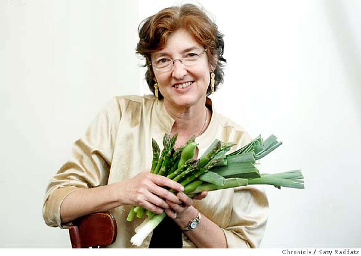 KINGSOLVER27_030_RAD.jpg SHOWN: Barbara Kingsolver poses for a portrait at Zuni Cafe with a bunch of local vegetables from the kitchen: asparagus, fava beans, and leeks. Barbara Kingsolver and her husband Steven L. Hopps enjoyed lunch at Zuni Cafe in San FRancisco. Barbara Kingsolver has just published a book called "Animal, Vegetable, Miracle A Year of Food Life." These pictures were made in San Francisco, CA. on Tuesday, May 15, 2007. (Katy RaddatzThe Chronicle) **Barbara Kingsolver, Steven L. Hopps Ran on: 05-27-2007 Barbara Kingsolver and family spent a year eating mostly what they grew. Ran on: 05-27-2007
