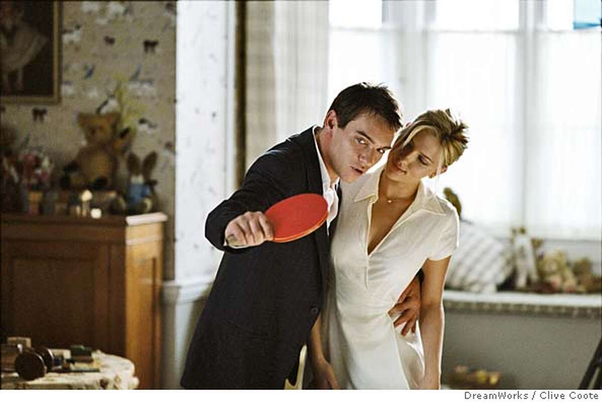 Tennis pro Chris Wilton (JONATHAN RHYS MEYERS) gives Nola Rice (SCARLETT JOHANSSON) a ping-pong lesson in Woody Allen�s new dramatic thriller MATCH POINT to be distributed domestically by DreamWorks. Photo by Clive Coote