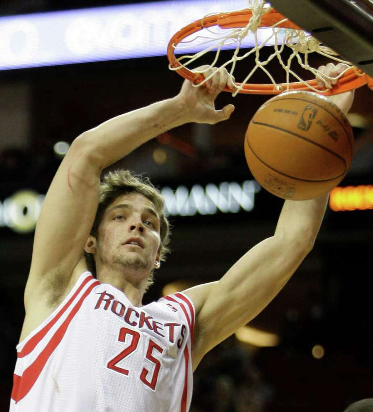 Houston Rockets' Chandler Parsons dunks the ball against the Detroit Pistons' during NBA game at Toyota Center Tuesday, Jan. 17, 2012, in Houston.