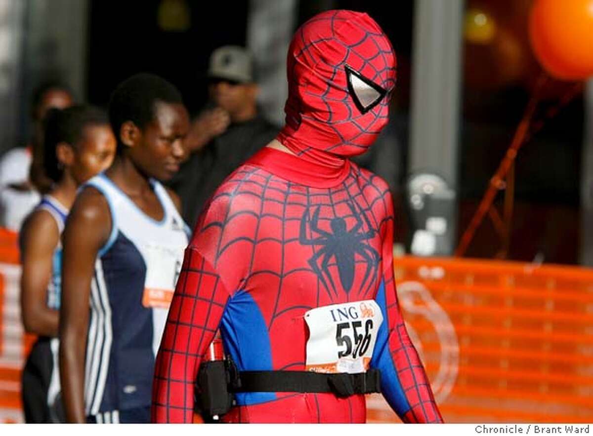 Yes that was Spiderman walking with some of the elite Kenyan runners minutes before the race started. The 96th annual Bay to Breakers foot race took over the streets of San Francisco Sunday morning as thousands ran from Howard and Beale Streets to Ocean Beach. {Brant Ward/San Francisco Chronicle}5/20/07