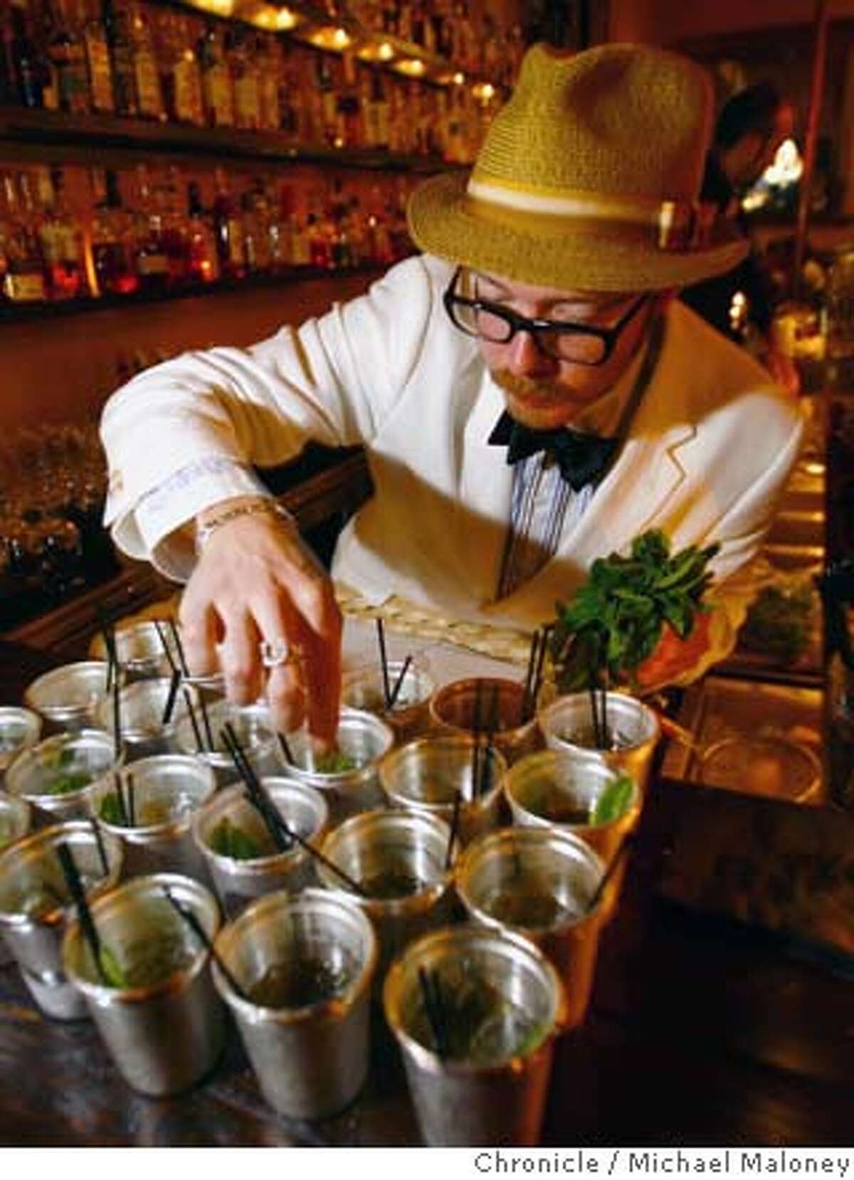 Daniel Hyatt, bar manager at Alembic (1725 Haight) puts the finishing touches (mint leaves) on the mint julip cocktails. Several of San Francisco�s top mixologists have organized a week-long celebration (called the San Francisco Cocktail Week)of San Francisco�s vibrant cocktail scene that culminates on Monday, May 21st at Absinthe Brasserie & Bar. On Monday, May 14, 2007, participants (mostly journalists and bar owners and workers) boarded a bus that transported them to a half dozen participating bars where they could sample two unique cocktails at each bar. Photo taken on 5/14/07 in San Francisco, CA. Photo by Michael Maloney / San Francisco Chronicle *** Daniel Hyatt Ran on: 05-18-2007 Co-owner Aaron Prentice, left, mixes up a pisco punch at Cantina, a bar that opened earlier this week. Above, Alembic bar manager Daniel Hyatt lines up mint juleps.