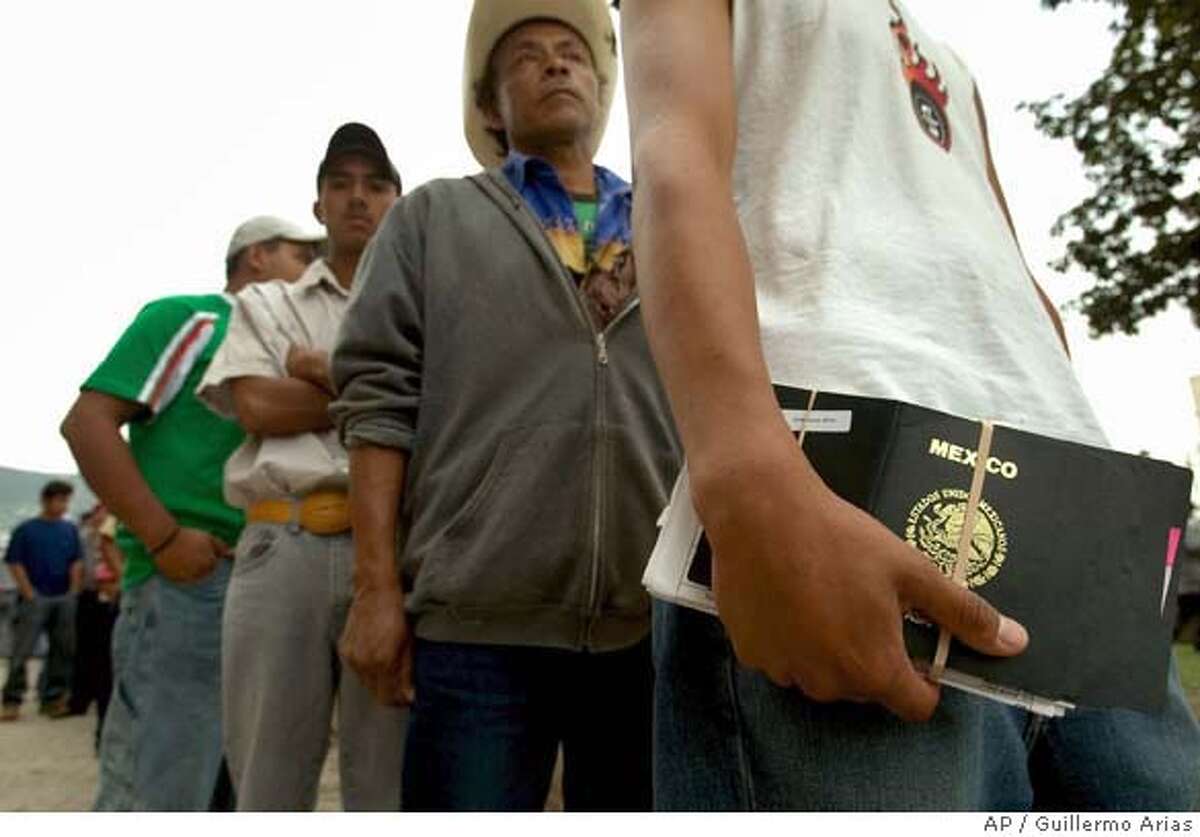 Mexicans line up outside de U.S. Consulate in Monterrey, Mexico, as they wait for a working visa interview, Thursday, May 17, 2007. Key senators in both the Democrat and the Republican parties, together with the White House, announced an agreement Thursday on an immigration overhaul that would grant quick legal status to millions of illegal immigrants already in the U.S. and fortify the border. (AP Photo/Guillermo Arias)