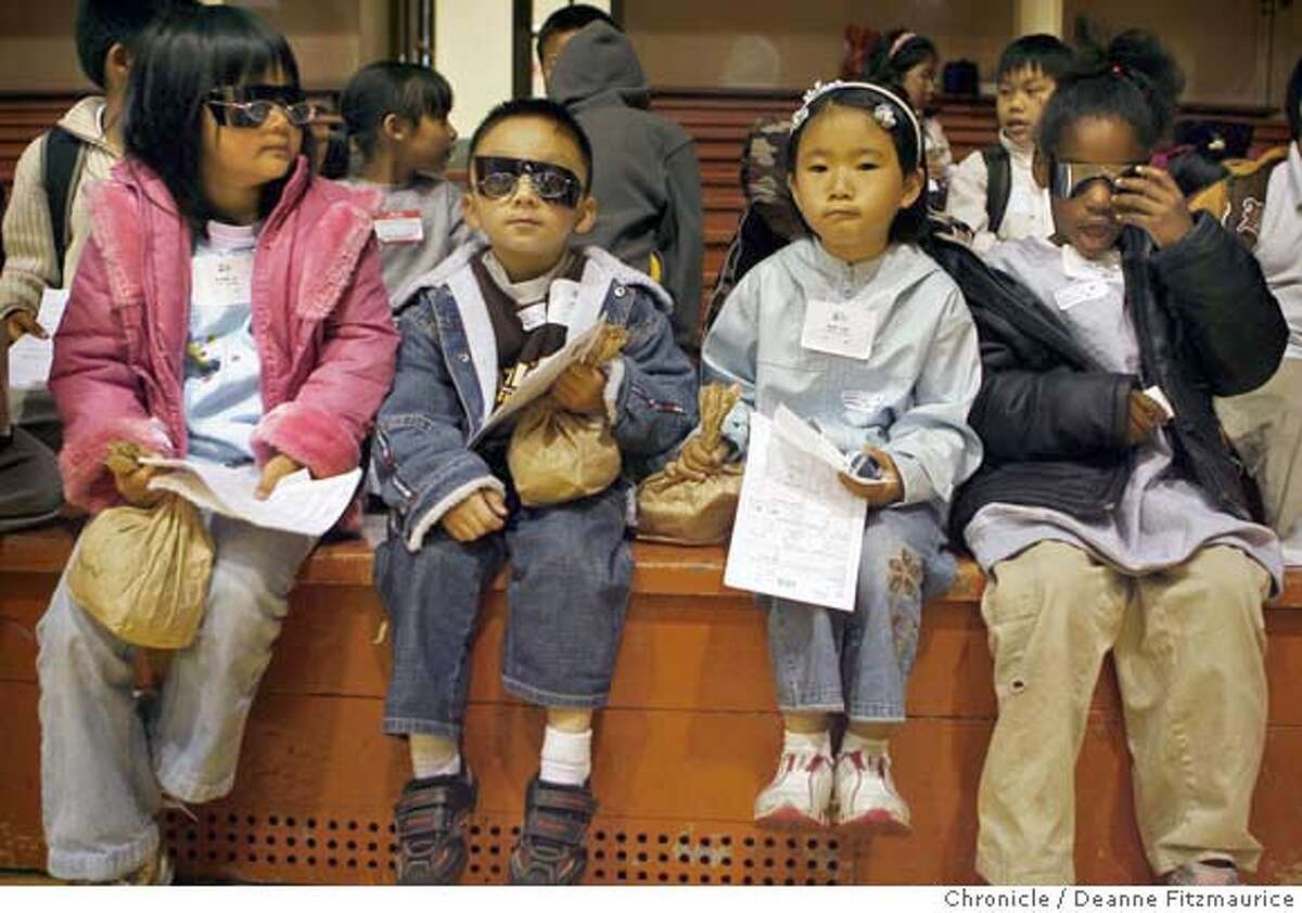 glasses16_147_df.jpg (l to r) Krystal Vi, Leon Ng, Amy Liao, and Diane Walker, all from Gordon Lau Elementary School are in various stages of having their eyes dilated. San Francisco kids get their vision checked at Kezar gymnasium. This is a program, the Gift of Sight, helping low-income students see better. Photographed in San Francisco on 5/15/07. Deanne Fitzmaurice / The Chronicle Mandatory credit for photographer and San Francisco Chronicle. No Sales/Magazines out.