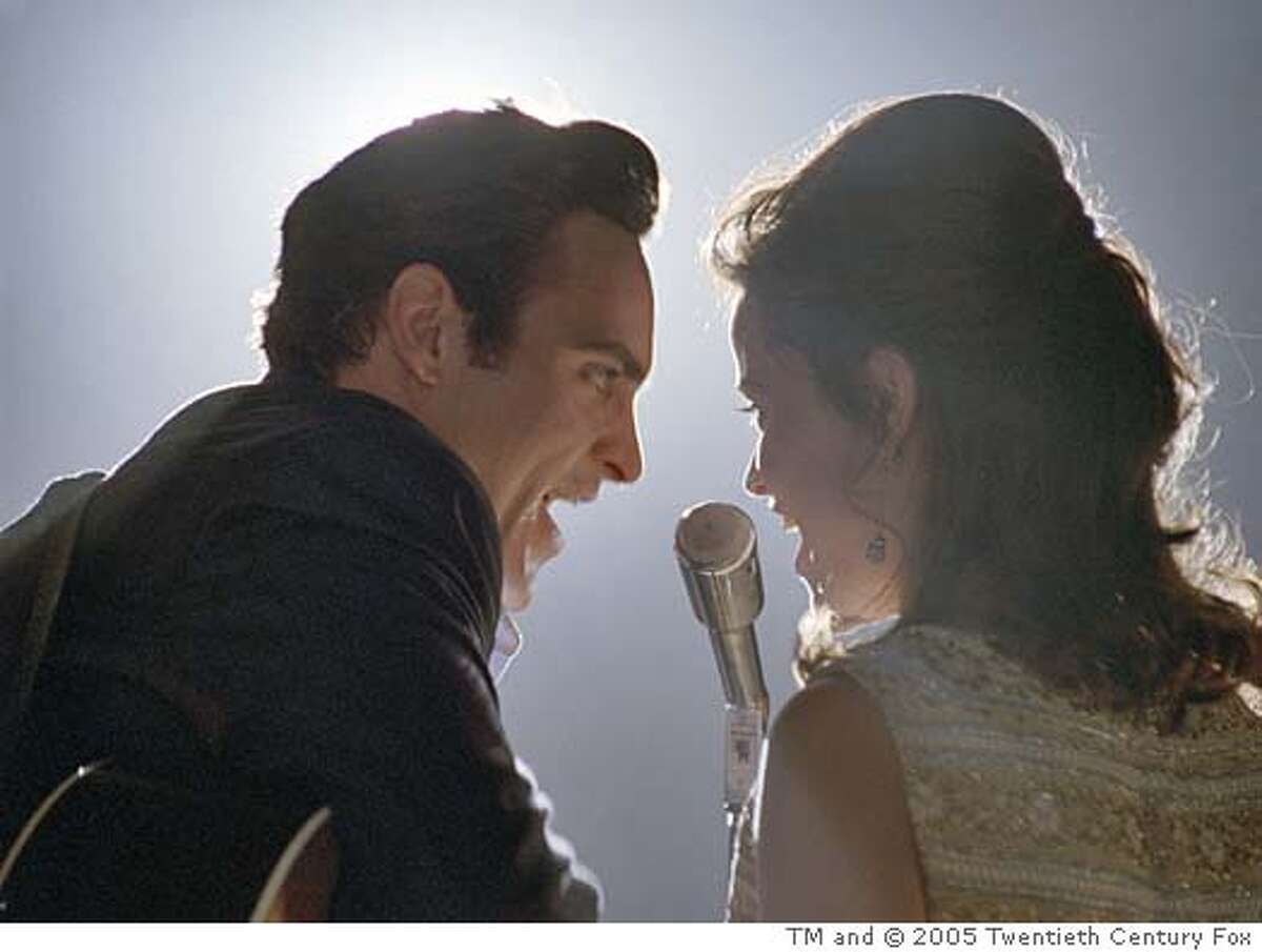 WALK18 Musicians Johnny Cash (Joaquin Phoenix) and June Carter (Reese Witherspoon) perform in WALK THE LINE. TM and � 2005 Twentieth Century Fox. All Rights Reserved. Not for sale or duplication.