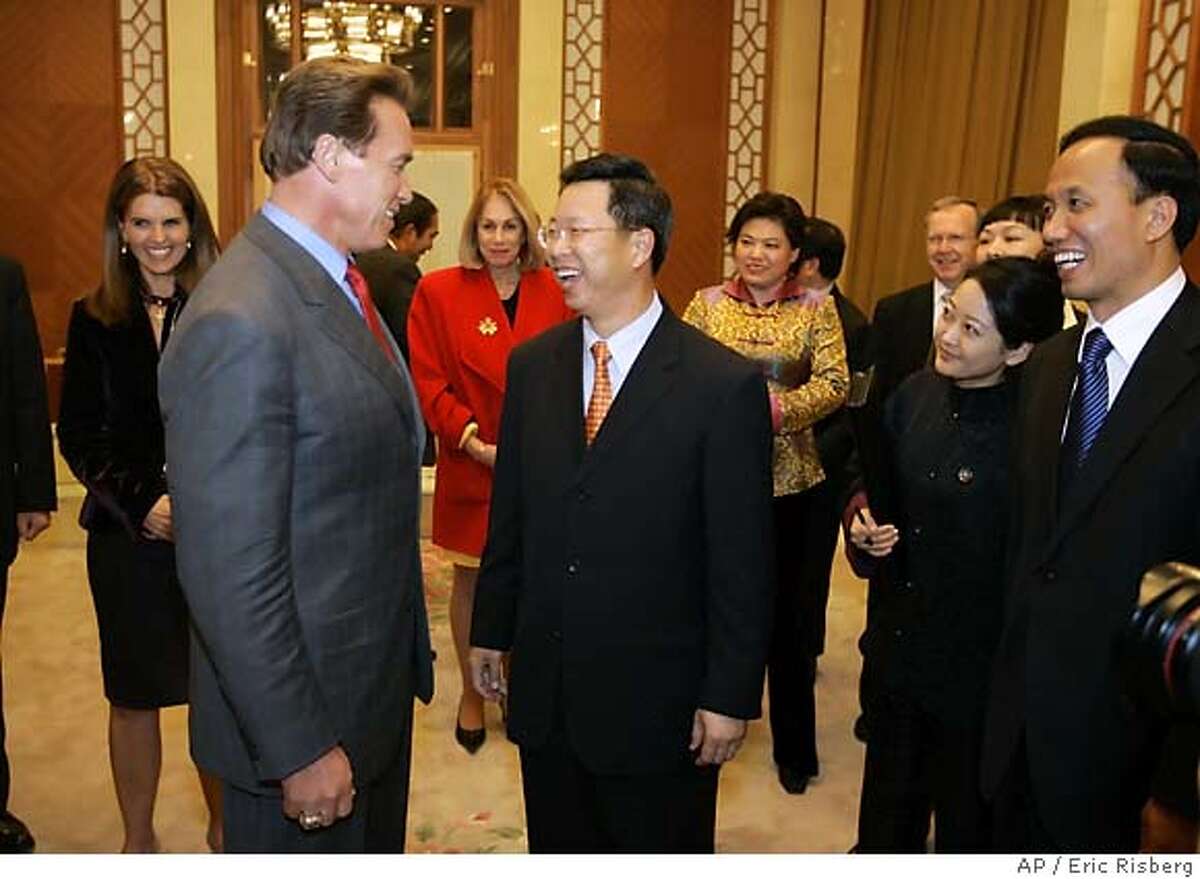 California Gov. Arnold Schwarzenegger, talks with Ping Yui, Vice Chairman of the China Council for the Promotion of International Trade during a reception before a dinner at the Great Hall of the People in Beijing Tuesday Nov. 15, 2005. The governor is on a six-day trade mission to Beijing, Shanghai and Hong Kong. At far left is Maria Shriver, the governor's wife and California's First Lady. (AP Photo/Eric Risberg)