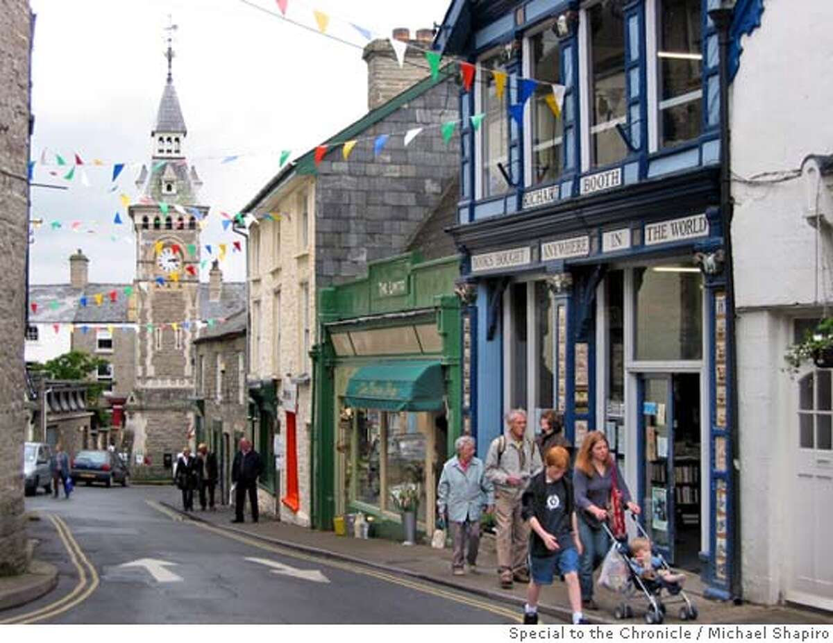 � TRAVEL HAY -- Visitors to Hay-on-Wye in Wales explore the medival village's narrow streets and bookshops during the annual Guardian Hay Festival, which attracts leading authors and entertainers. Michael Shapiro / Special to The Chronicle one-time use only for Travel (OK for SFGate)