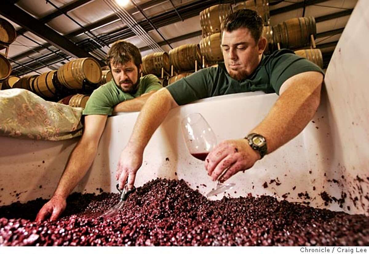 SBARBARA10.s1_144_cl.JPG Wine section cover story on winemakers in Santa Barbara County. Photo of McPrice Myers (right) and Russell From (left), both young guys making wine separately as McPrice Myers Wine Co. and Herman Story Wines in Santa Maria. They both make a wine together called Barrel 27. Photo of them checking out some of their Grenache grapes. Event on 11/1/05 in Santa Maria. Craig Lee / The Chronicle MANDATORY CREDIT FOR PHOTOG AND SF CHRONICLE/ -MAGS OUT