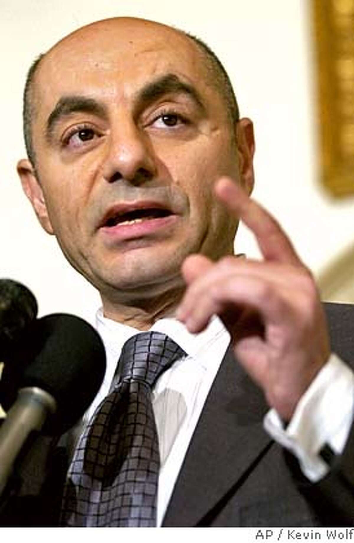 Syrian Ambassador Imad Moustapha responds to a U.N. report on Friday, Oct. 21, 2005 at the Syrian Embassy in Washington. Syria hotly dismissed on Friday a U.N. report that linked embattled President Bashar Assad's government in the assassination of a former Lebanese prime minister, as Damascus geared up to fight off growing Western sentiment to punish it with crippling economic sanctions. (AP Photo/Kevin Wolf)