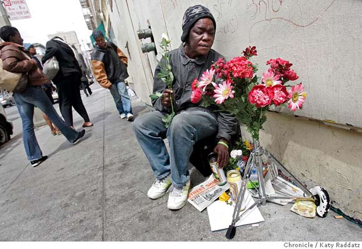 SHOWN: Linda Thomas, who claims she is the widow of Monte Holmes, adds a rose to the bouquet at the shrine erected in his honor. A memorial shrine of flowers and souvenirs has been erected on Taylor St. near the corner of Turk St. in San Francisco to honor the life and mark the death of Monte Holmes, who traveled around on a skateboard because he was legless, and was hit and killed by a US Mail truck on Tuesday, April 24, 2007. These pictures were made in San Francisco, CA. on Wednesday, April 25, 2007. (Katy Raddatz/The Chronicle) **Linda Thomas, Monte Holmes