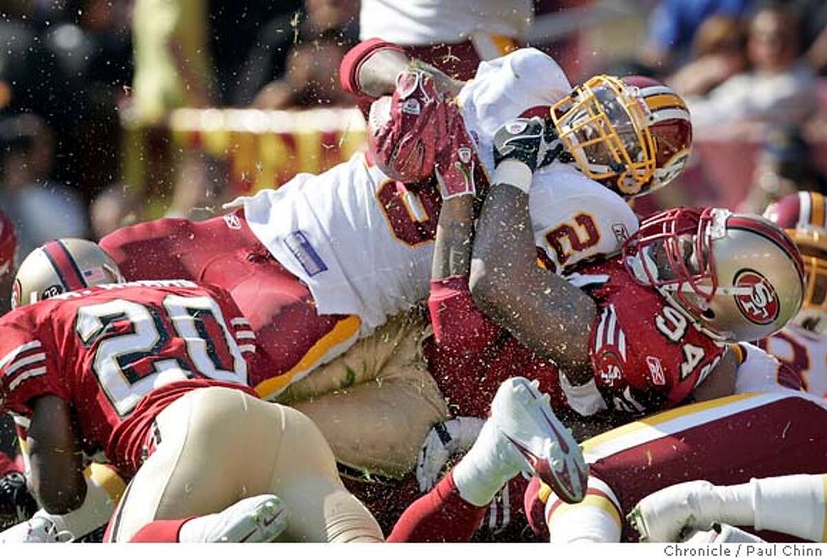 Tackle Kwame Harris of the San Francisco 49ers takes a break against