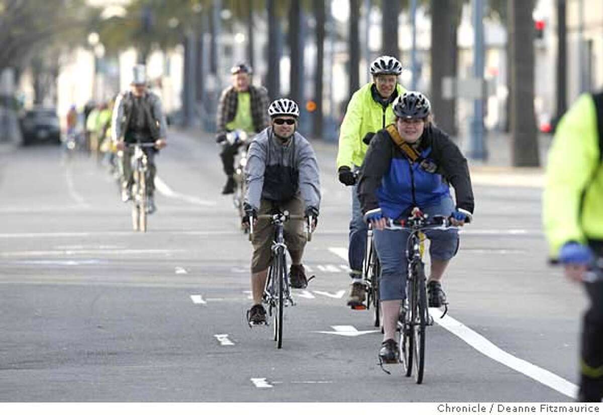 Bike riders ride in a bike lane along the Embarcadero as they take part in Critical Manners, a polite alternative to Critical Mass bike ride in San Francisco on 4/13/07. Deanne Fitzmaurice / The Chronicle