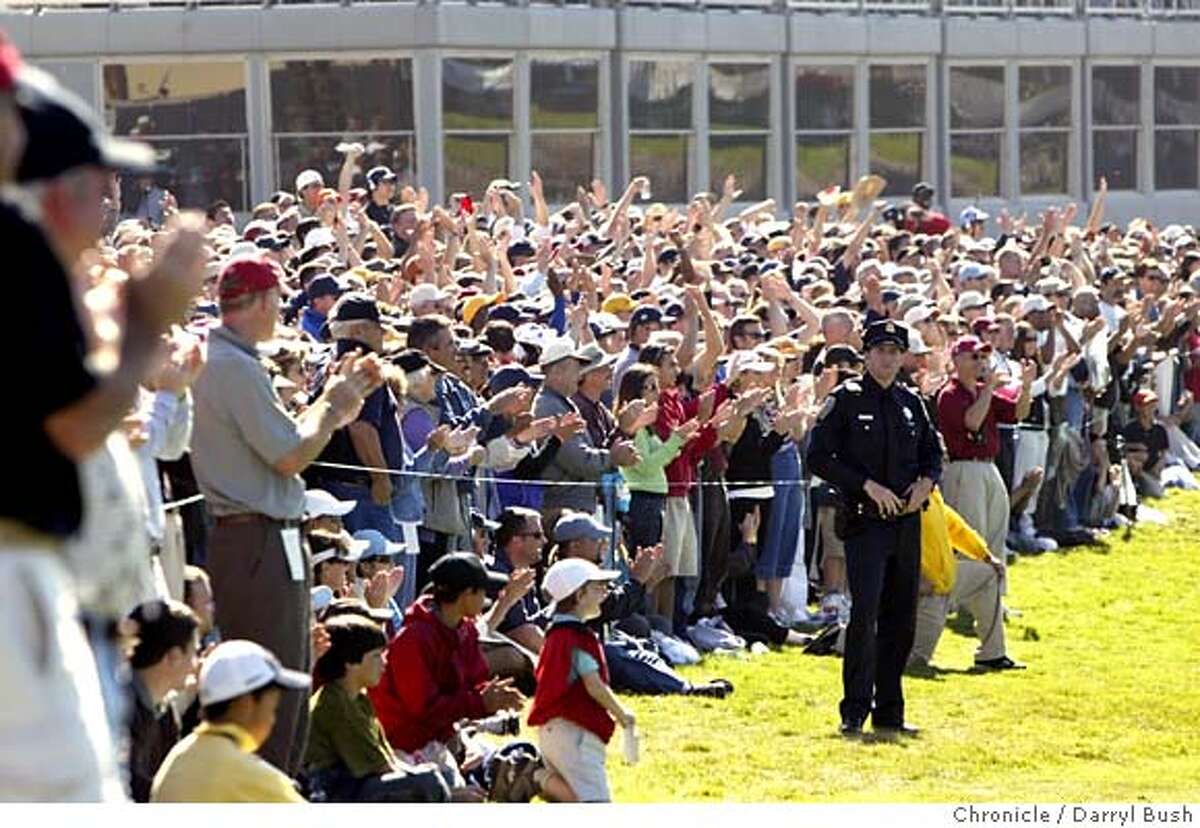 AMEXgolf_0028_db.jpg The crowd cheers around the 18th hole as John Daly and Tiger Woods as they head out for a playoff to the 18th at the American Express Championship at Harding Park Golf Course. Event on 10/9/05 in San Francisco. Darryl Bush / The Chronicle MANDATORY CREDIT FOR PHOTOG AND SF CHRONICLE/ -MAGS OUT