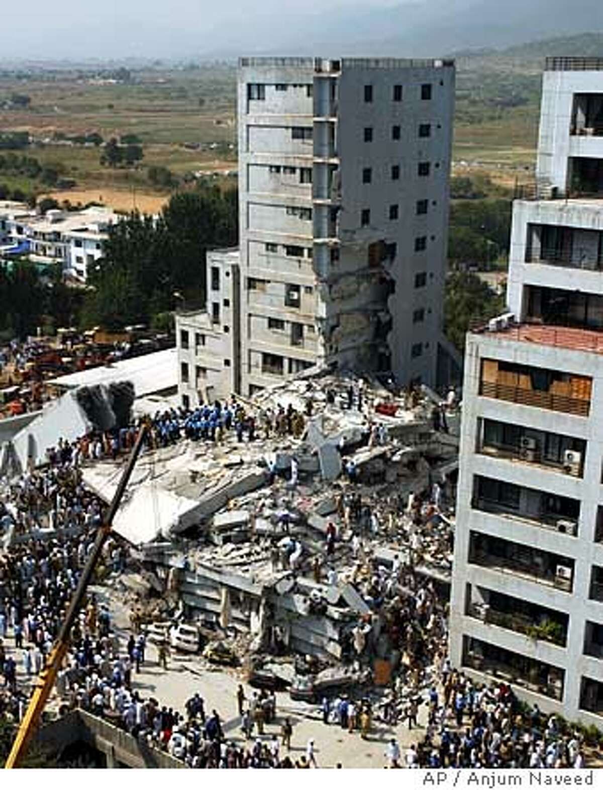 At least 20 dead in collapse of luxury apartment complex