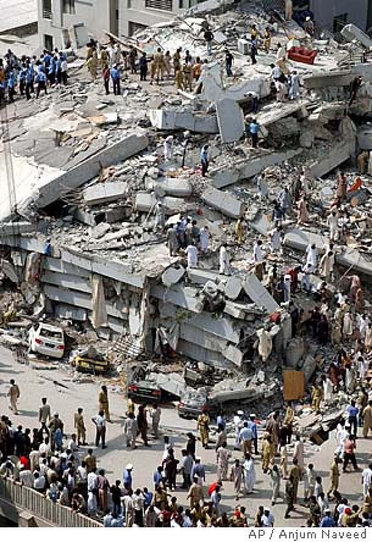 At least 20 dead in collapse of luxury apartment complex