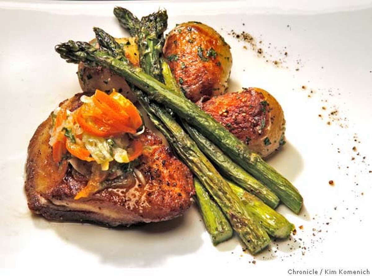 The pan-seared Hawaiian walu, served with kumquat, fennel and spring onion relish, roasted asparagus and potato persillade. Chronicle photo by Kim Komenich