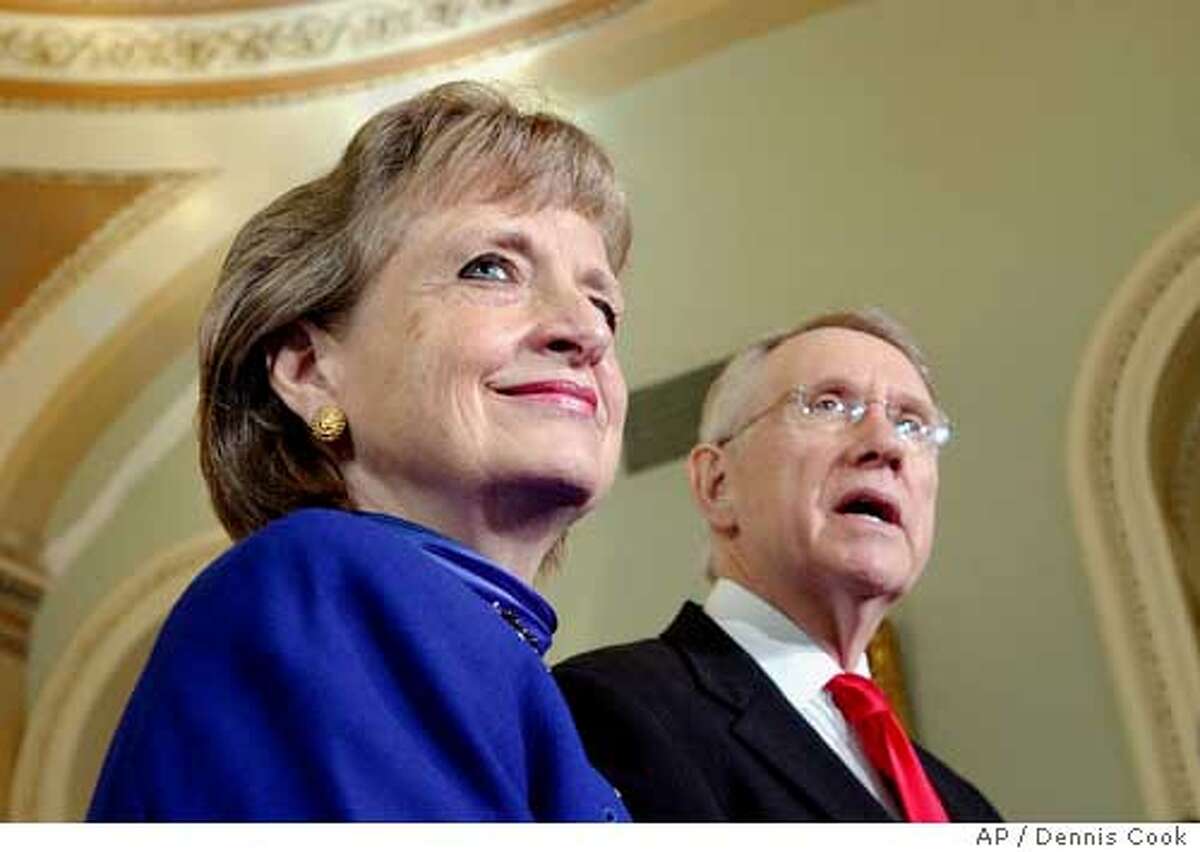 Supreme Court nominee Harriet Miers listens as Senate Minority Leader Harry Reid, D-Nev., talks during a news conference on Capitol Hill, Monday, Oct. 3, 2005, after President Bush nominated Miers to the Supreme Court to replace retiring Justice Sandra Day O'Connor. (AP Photo/Dennis Cook) Ran on: 10-04-2005 Harriet Miers, selected by President Bush to fill Justice Sandra Day OConnors spot on the Supreme Court, joined the Bush administration in 2001 after 30 years as a corporate lawyer. Ran on: 10-04-2005 Harriet Miers, selected by President Bush to fill Justice Sandra Day OConnors spot on the Supreme Court, joined the Bush administration in 2001 after 30 years as a corporate lawyer.
