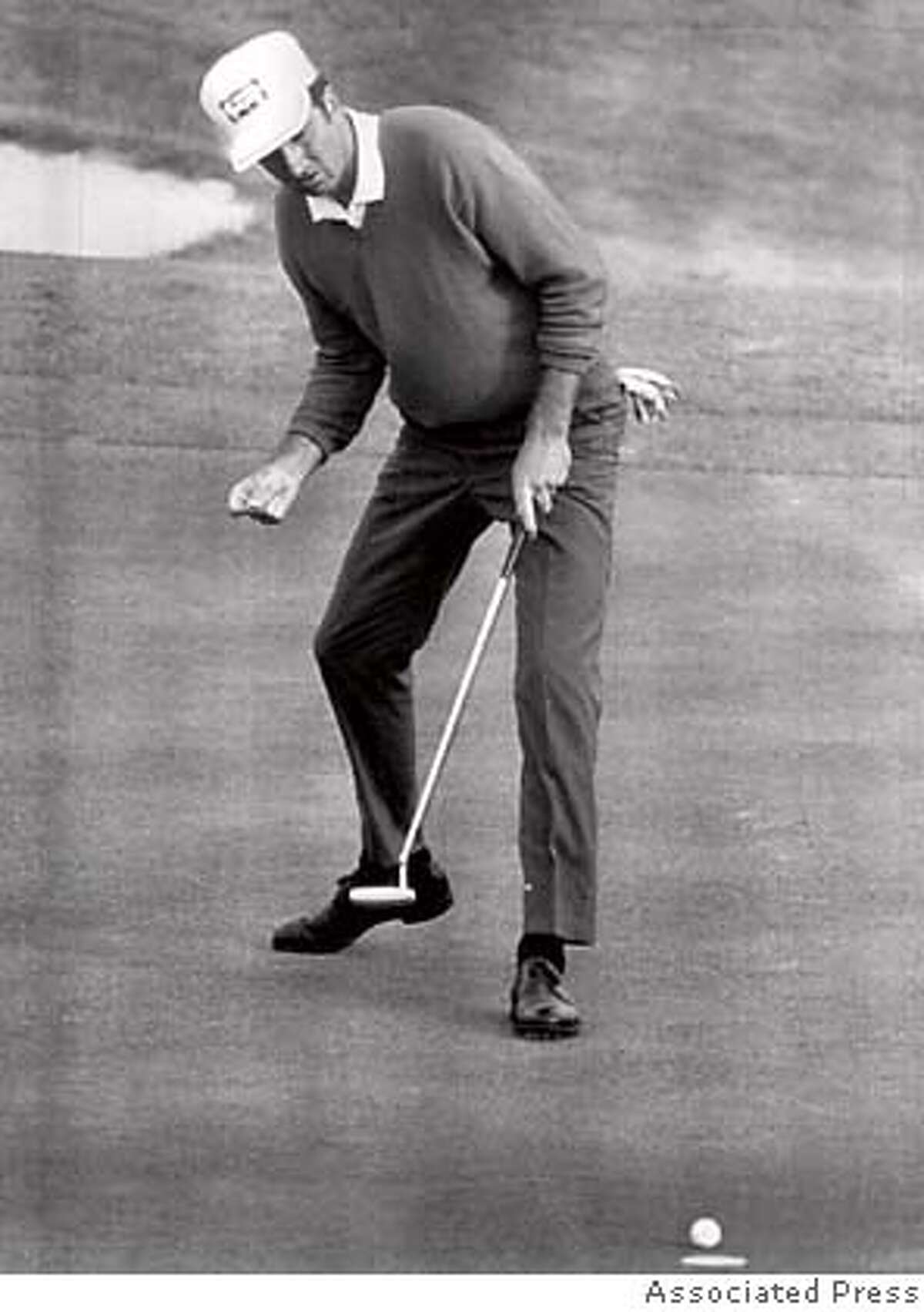 George Archer's birdie putt at 18 is short, in final round of 1969 Masters. Archer one.