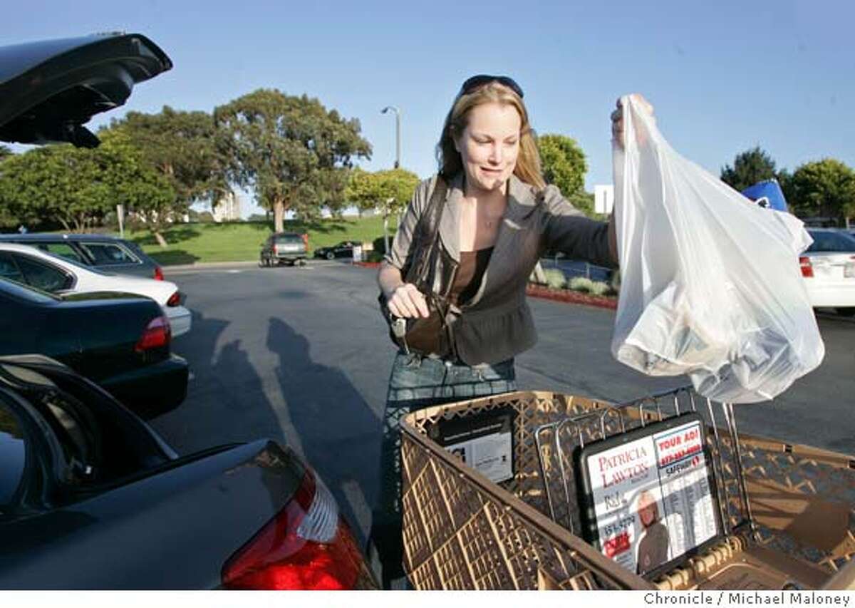 Robyn Hunter of San Francisco, loads plastic bags full of groceries into the trunk of her car after shopping at the Marina Safeway in San Francisco, CA. She said she will purchase re-useable canvas bags in the future. The San Francisco Board of Supervisors voted today, March 27, 2007 to ban plastic bags at groceries and pharmacies, making SF the first city in the nation to pass such a ban. Photo by Michael Maloney / San Francisco Chronicle ***Robyn Hunter MANDATORY CREDIT FOR PHOTOG AND SF CHRONICLE/NO SALES-MAGS OUT