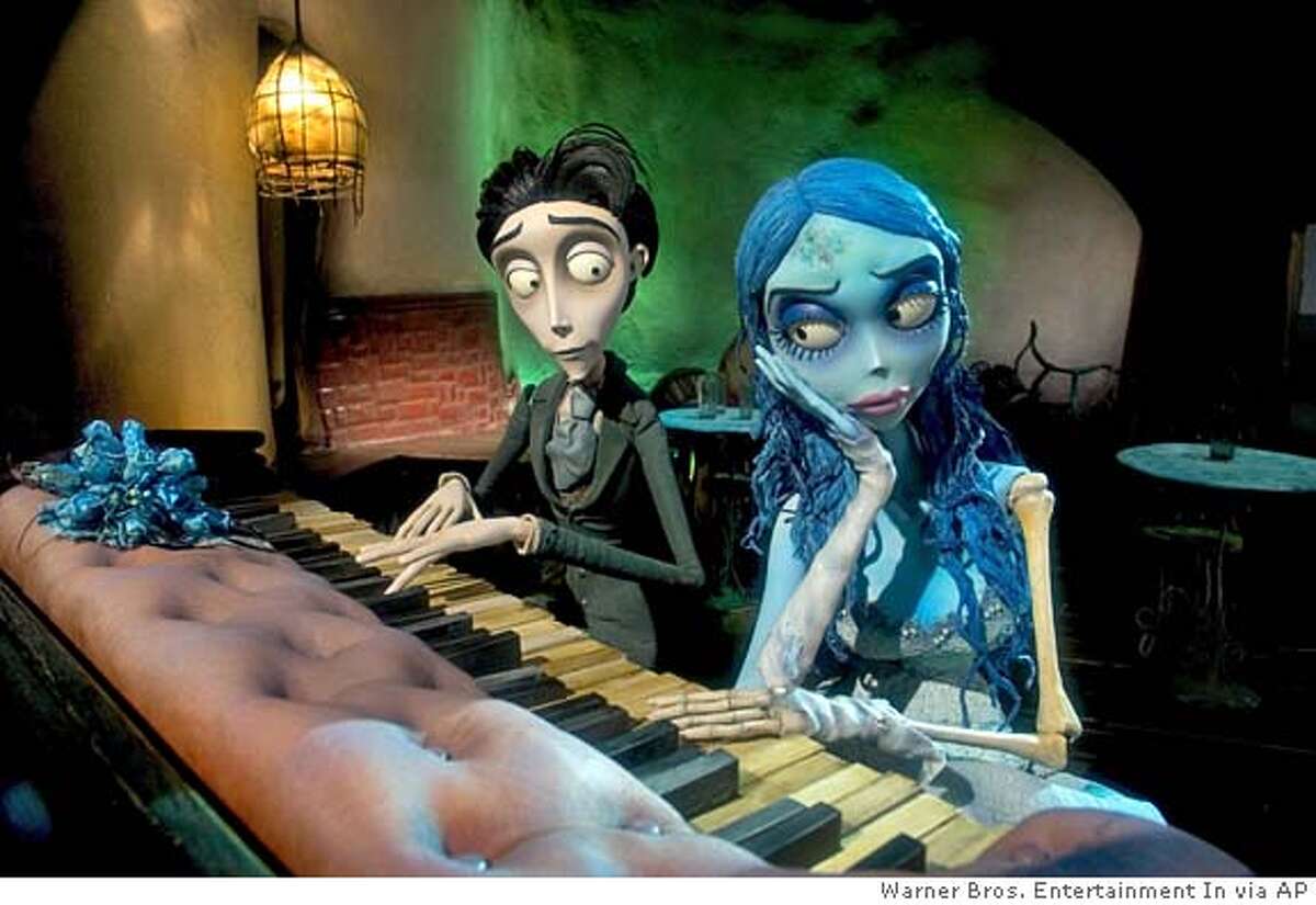Victor Van Dort, left, voiced by Johnny Depp, and the Corpse Bride, voiced by Helena Bonham Carter,are shown in a scene from Warner Bros. Pictures stop-motion animated fantasy Tim Burtons Corpse Bride. (AP Photo/Warner Bros. Entertainment In.) MAGS OUT, PHOTOGRAPHS