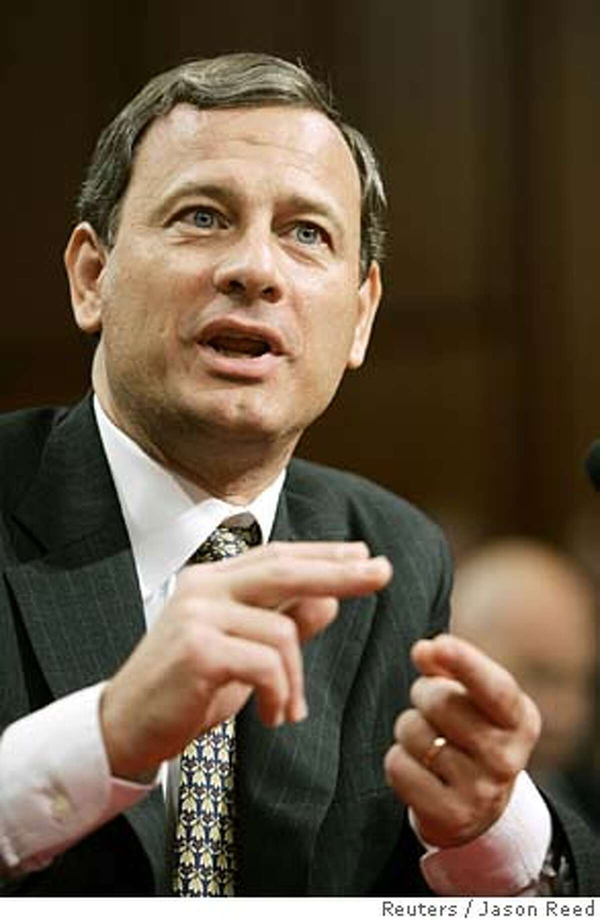 Chief Justice nominee John Roberts answers a question on the last day of his public testimony at his Senate Judiciary Committee confirmation hearings on Capitol Hill in Washington, September 15 , 2005. Supreme Court nominee John Roberts, on a glide path to Senate confirmation, promised on Thursday that he would be a chief justice who respects the law and not an ideologue as some Democrats said they fear. REUTERS/Jason Reed 0