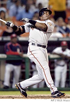 Bonds handles the boos with swing of the bat.