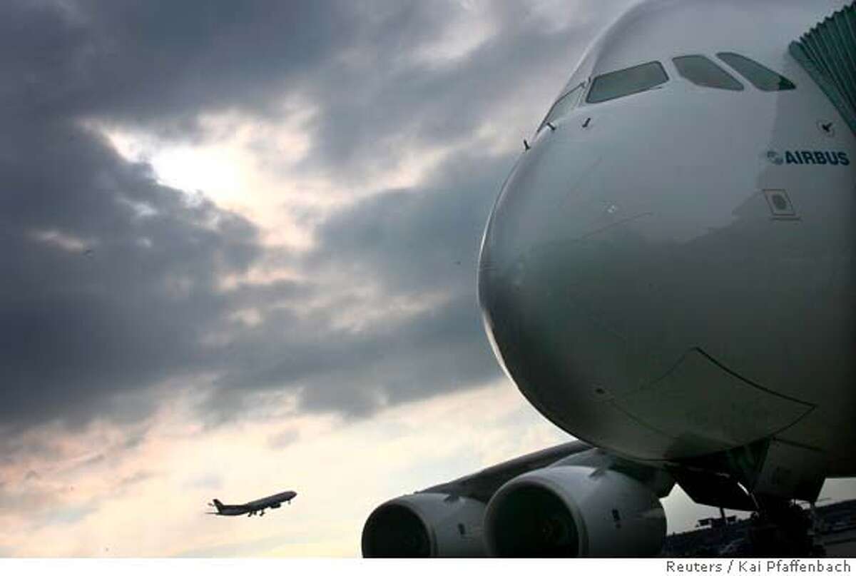 The new Airbus A 380 super jumbo jet airplane stands at Frankfurt airport prior to its first passenger flight early morning, March 19, 2007. REUTERS/Kai Pfaffenbach (GERMANY) 0