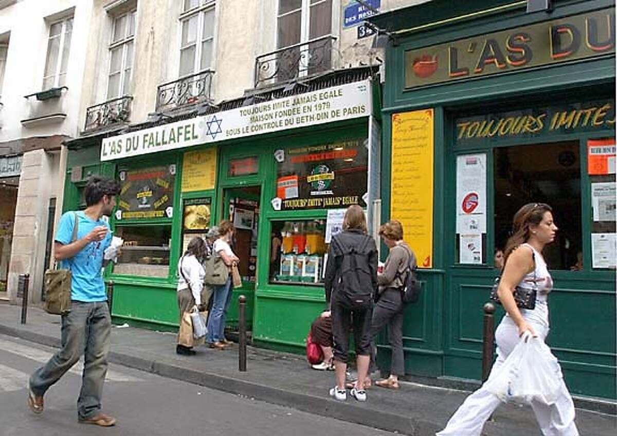 Many lives of Paris' storied Marais district / Rough edges give way to ...