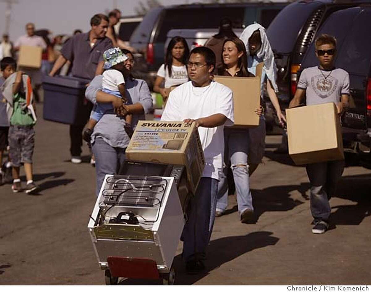 UCMERCED_1469_kk.JPG Alex Rodriguex wheels the posessions of his sister Jo-Anne (cq) Rodriguez from the parking lot to the dorms during move-in day at UC Merced. Jo-Anne is behind and to the left of Alex. Jo-Ann's cousin Maureen Sabatin is behind and to the rightof Alex. They are all from Santa Clara. In all, 14 members of her family helped with the move. She is the first member of her family to attend university Aerial photos of the UC Merced campus a few days before school opens. Meanwhile, on the ground, families help freshmen move into the dorms San Francisco Chronicle Photo by Kim Komenich 9/3/05