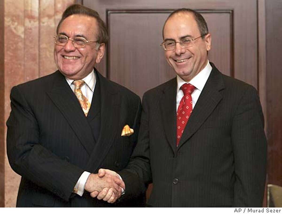 Pakistani Foreign Minister Khursheed Kasuri, left, shakes hands with his Israeli counterpart Silvan Shalom in Istanbul, Turkey, Thursday, Sept. 1, 2005. The foreign ministers of Israel and Pakistan, a Muslim country that has long taken a hard line against the Jewish state, met publicly for the first time, a diplomatic breakthrough that follows Israel's withdrawal from the Gaza Strip. Israeli Foreign Minister Silvan Shalom hailed the meeting as "historic" and said that following the Gaza withdrawal it is "the time for all of the Muslim and Arab countries to reconsider their relations with Israel. (AP Photo/Murad Sezer)