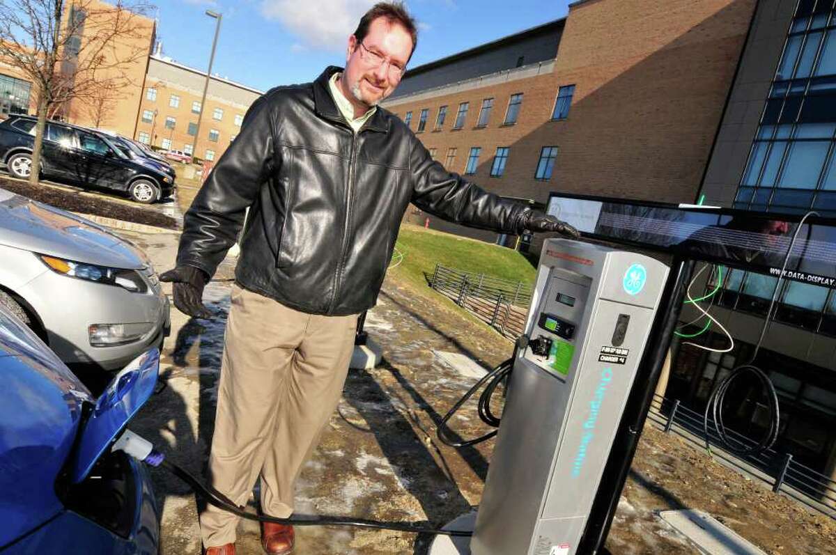 Matt Nielsen , principal scientist EV research , at GE Global Research at the five electric car charging stations in Niskayuna,NY Wednesday, Jan.18, 2012. The electric vehicles pictured are the Chevy Volt and Nissan LEAF.( Michael P. Farrell/Times Union)