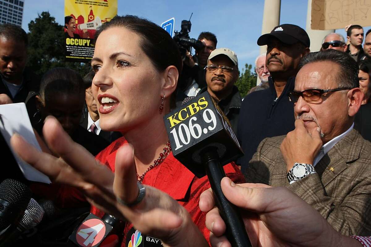 Oakland city councilmember Libby Schaaf (left) talks to the press at the bandstand next to Lake Merritt in 2011.