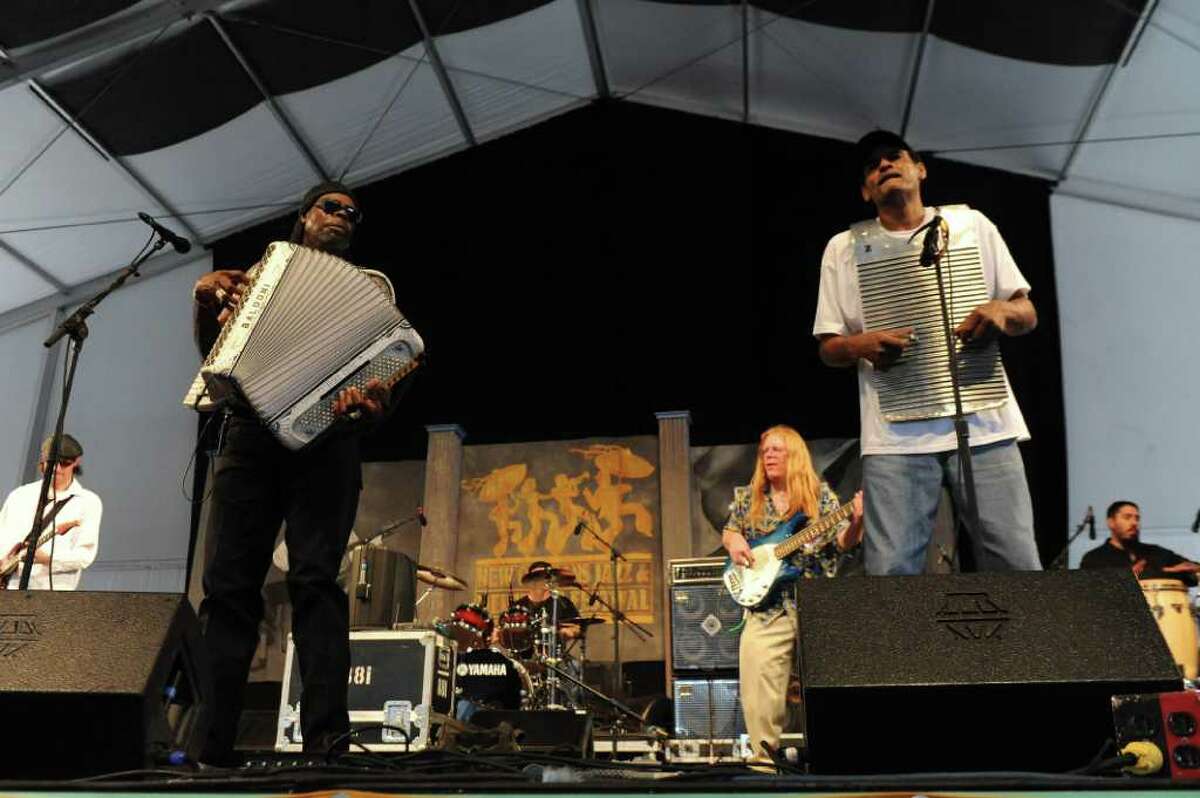 C.J. Chenier and the Red Hot Louisiana Band Clayton Joseph Chenier, the son of the great King of Zydeco, Clifton Chenier. C.J.'s father was the first Creole musician to win a Grammy Award.