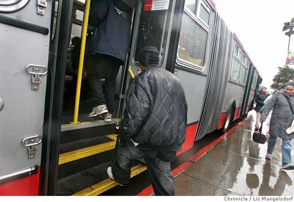 Muni riders board a bus at 16th and Mission Streets from the back, even though signs say it is illegal to board the bus from the back doors. Story is on how MUNI is not collecting all the fares that it could. Photographed on Feb. 26, 2007 . Photo by Liz Mangelsdorf/ San Francisco Chronicle