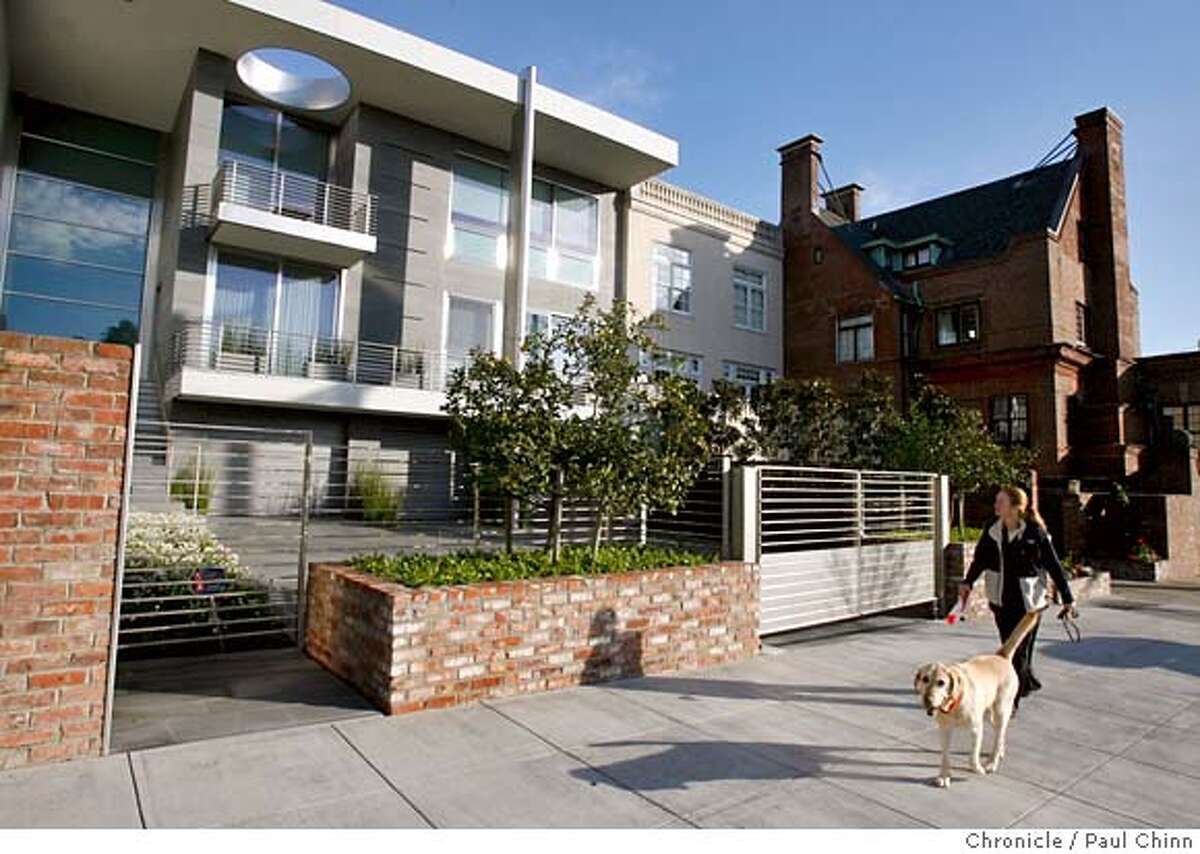 A neighbor walks past a futuristic-looking home across from Alta Plaza Park in San Francisco, Calif. on Thursday, February 15, 2007. PAUL CHINN/The Chronicle MANDATORY CREDIT FOR PHOTOGRAPHER AND S.F. CHRONICLE/NO SALES - MAGS OUT