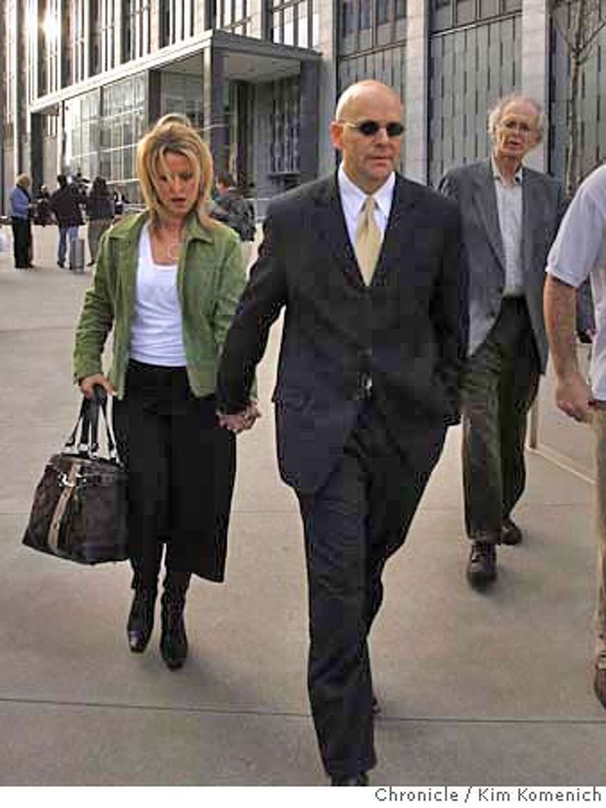 Attorney Troy Ellerman and unidentified companion exit the Federal Building in San Francisco after he leaking files in the BALCO case. The admission caused federal prosecutors to lift the subpoena against Chronicle reporters Mark Fainaru-Wada and Lance Williams. Photo by Kim Komenich/The Chronicle.