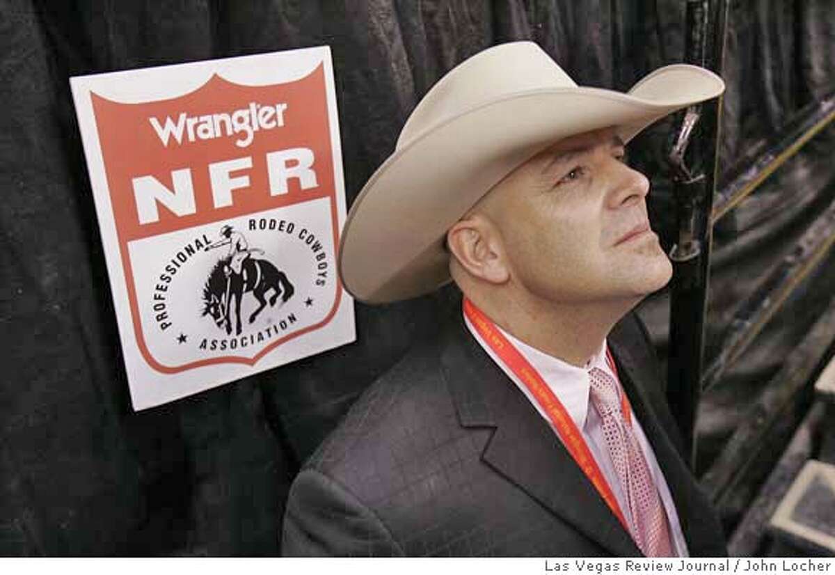 PRCA Commissioner Troy Ellerman watches the scoreboard at the National Finals Rodeo in Las Vegas Friday, Dec. 9, 2005.. (John Locher/LAS VEGAS REVIEW JOURNAL) d=Sports