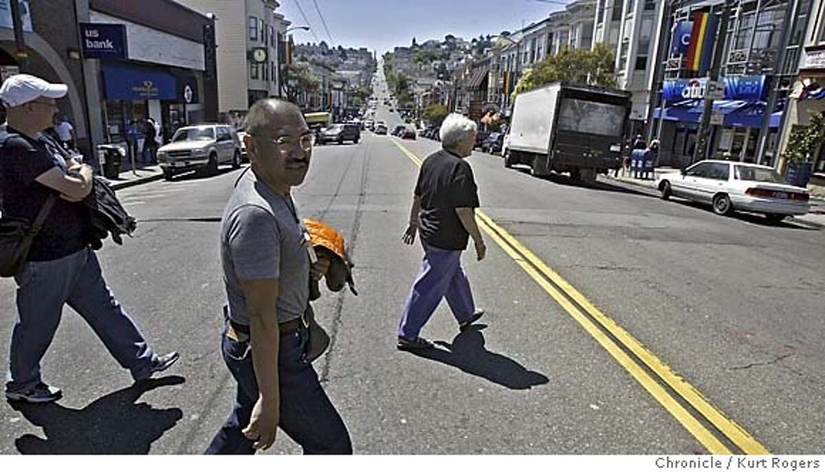 Trevor Hailey leads her tour J walking across Castro st she says its part of the castro experience. Trevor Hailey, 65, who's been leading the only walking tour of the Castro for the past 16 years, is retiring in mid-August. In the Castro's heyday, she led four-hour tours seven days a week for tourists from around the world TOUR_0036_kr.JPG 8/6/05 in San Francisco,CA. KURT ROGERS/ MANDATORY CREDIT FOR PHOTOG AND SF CHRONICLE/ -MAGS OUT