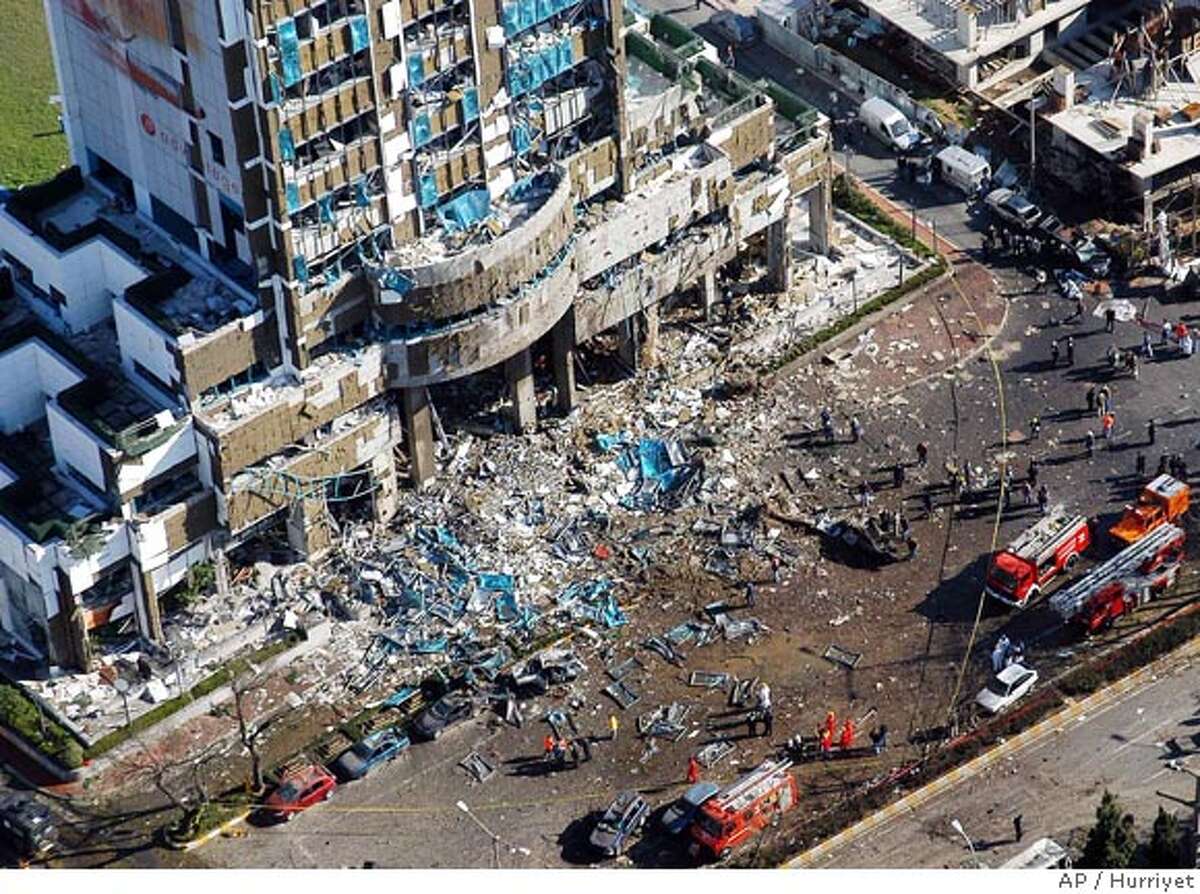 HSBC Bank building and its surrounding area is seen after an explosion in Istanbul, Turkey, Thursday Nov. 20, 2003. Explosions hit the Turkish headquarters of the London-based HSBC bank and the British consulate, killing at least 25 people and wounding about 400, health officials said. The blasts came days after the city was hit by two synagogue bombings. (AP Photo/Hurriyet) *** TURKEY OUT *** A wounded woman is carried away after a bomb exploded outside the nearby British consulate in Istanbul, killing the top diplomat. Photo caption turkey21_PH2_bank1069200000HURRIYETHSBC Bank building and its surrounding area is seen after an explosion in Istanbul, Turkey, Thursday Nov. 20, 2003. Explosions hit the Turkish headquarters of the London-based HSBC bank and the British consulate, killing at least 25 people and wounding about 400, health officials said. The blasts came days after the city was hit by two synagogue bombings. (AP Photo-Hurriyet) *** TURKEY OUT ***__TURKEY OUT The aftermath of the blast Nov. 20 at HSBC Bank building in Istanbul, in which 32 people died, is seen in this aerial photograph. The aftermath of the blast Nov. 20 at HSBC Bank building in Istanbul, in which 32 people died, is seen in this aerial photograph. The aftermath of the blast Nov. 20 at HSBC bank building in Istanbul, in which 32 people died, is seen in this aerial photograph. ALSO RAN 12/1/03 CAT TURKEY OUT