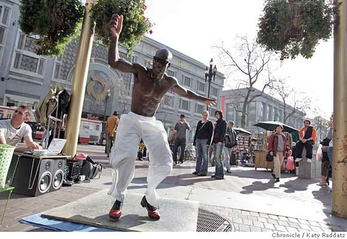 JACKSON01_108_RAD.jpg SHOWN: Edward Jackson is the tap dancer most often seen tap dancing at the cable car turnaround at Powell and Market Sts. in San Francisco. He will be moving to Australia soon, then Europe, where he's been told that street artists make better livings than here. The man squatting on the far LEFT is Pavel Levchenko Edward's sound technician. These pictures were made on Sunday, Feb. 4, 2007, in San Francisco, CA. (Katy Raddatz/SF Chronicle) **Pavel Levchenko Mandatory credit for the photographer and the San Francisco Chronicle. ; mags out.