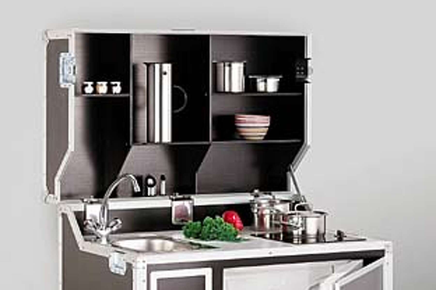 Mini kitchen fits studio or in-law unit / In tiny spaces, furniture must be  multitalented