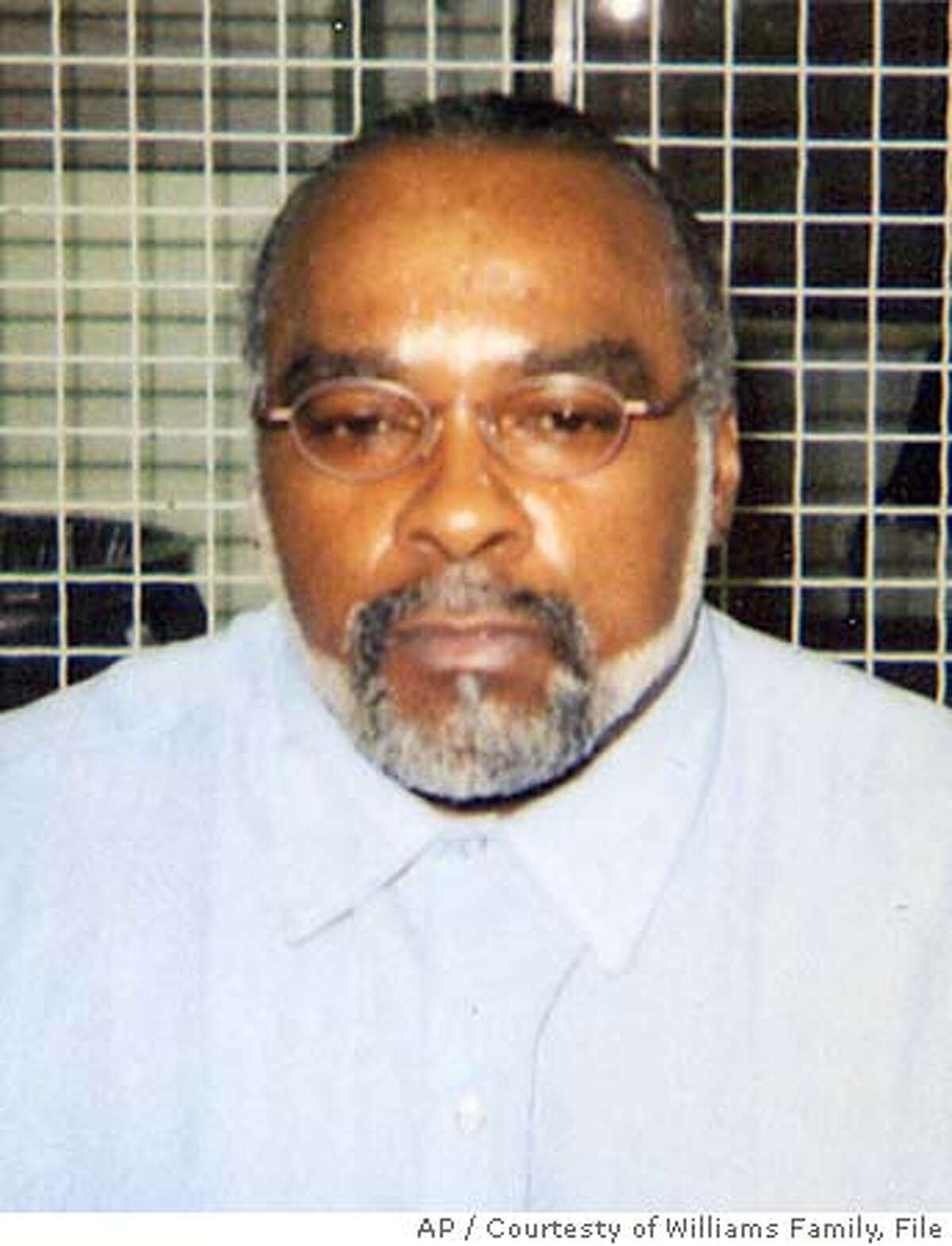 ** FILE ** In this undated photo provided by the family of Stanley Williams, Stanley "Tookie" Williams poses for a photo in the visiting area of San Quentin State Prison in California. Williams has received the President's Call to Service Award, complete with a letter from the White House signed by President Bush praising the co-founder of the notorious Crips gang for demonstrating "the outstanding character of America." Williams, 53, who started the Crips in Los Angeles in 1971 with high school buddy, Raymond Washington, was convicted in 1981 for killing four people. He's been on death row at San Quentin State Prison for two dozen years. (AP Photo/Courtesty of Williams Family, File)