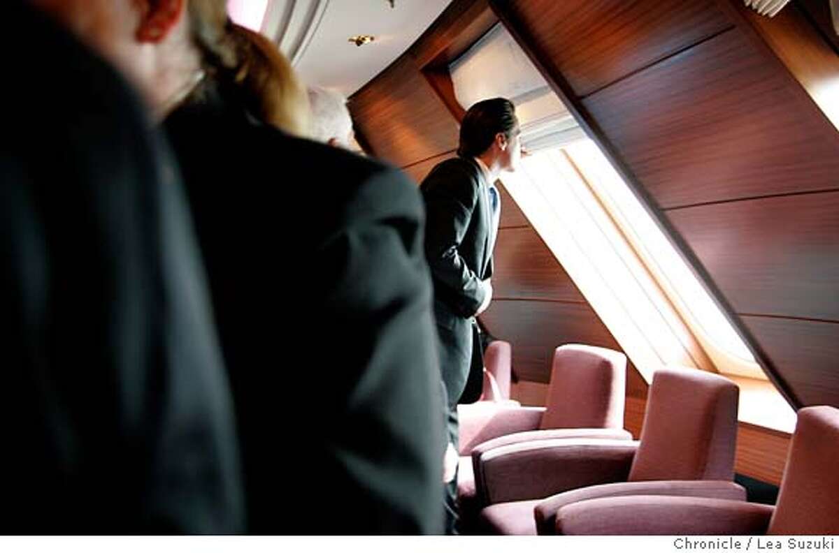 Mayor Gavin Newsom looks out a window at the Commodore Club before presenting Captain Rynd with a proclomation. Media tours of the Queen Mary 2 and Mayor Newsom presents a proclomation to Captain Christopher Rynd on Monday, February 5, 2007. Photo by Lea Suzuki/The San Francisco Chronicle Photo taken on 2/5/07, in San Francisco, CA. **(themselves) cq.