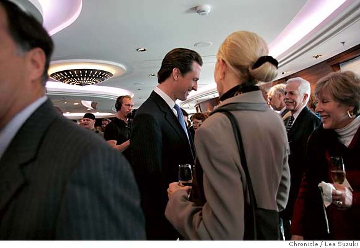 queen06_223_ls.jpg Mayor Gavin Newsom talks with guests in the Commodore Club aboard the Queen Mary 2 before the Plaque and Key, a traditional ceremony when the boat comes into port, and Mayor Newsom's presenting of a proclamation. Media tours of the Queen Mary 2 and Mayor Newsom presents a proclomation to Captain Christopher Rynd on Monday, February 5, 2007. Photo by Lea Suzuki/The San Francisco Chronicle Photo taken on 2/5/07, in San Francisco, CA. **(themselves) cq.