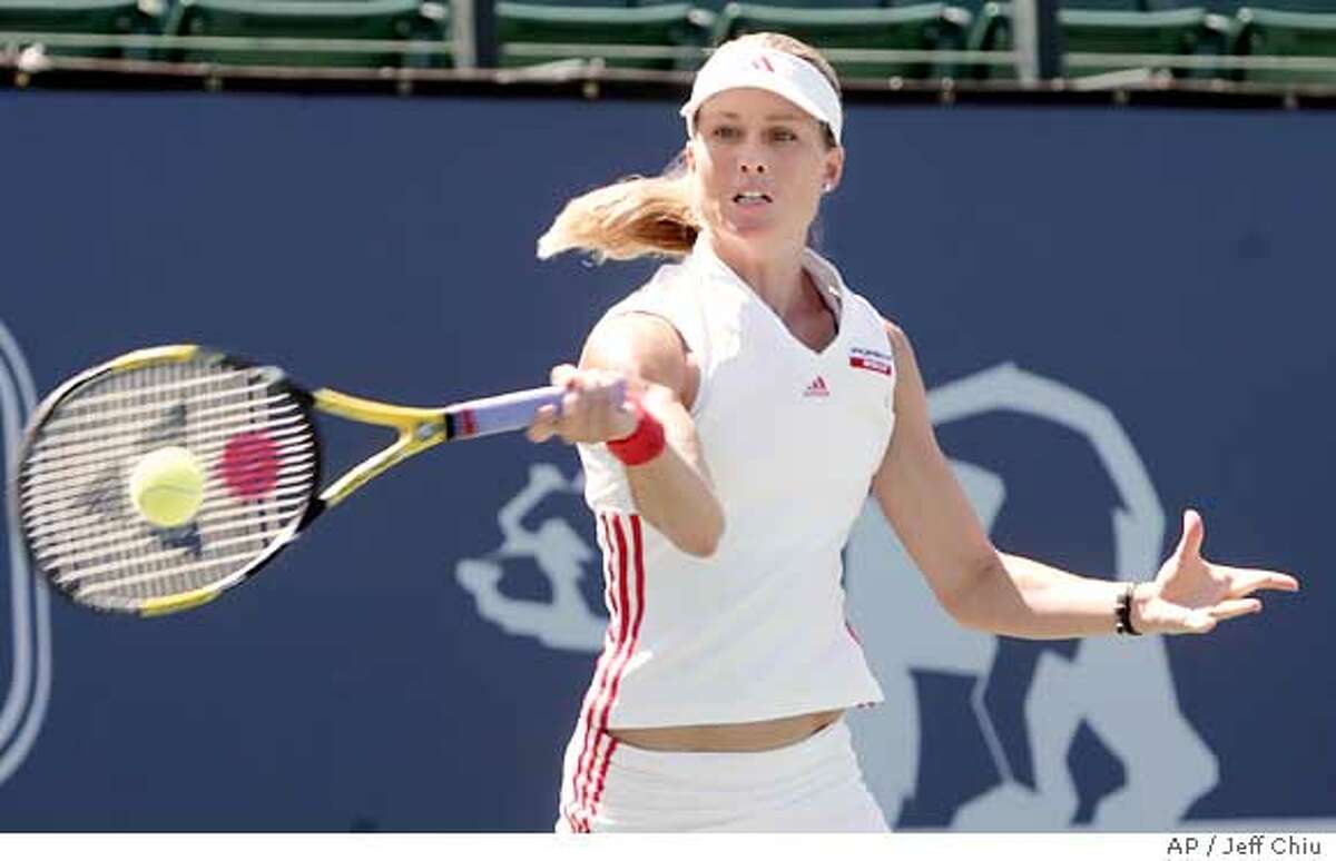 Meghann Shaghnessy hits a shot in the first set against Vera Zvonareva in their second round match in the Classic in Stanford, Calif., Tuesday, July 26, 2005. Shaughnessy won 6-3, 1-6, 7-6 (8-6). (AP Photo/Jeff Chiu)